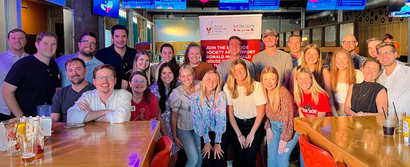 Red Shoe Society members gather at a Tulsa community event supporting Ronald McDonald House Tulsa.