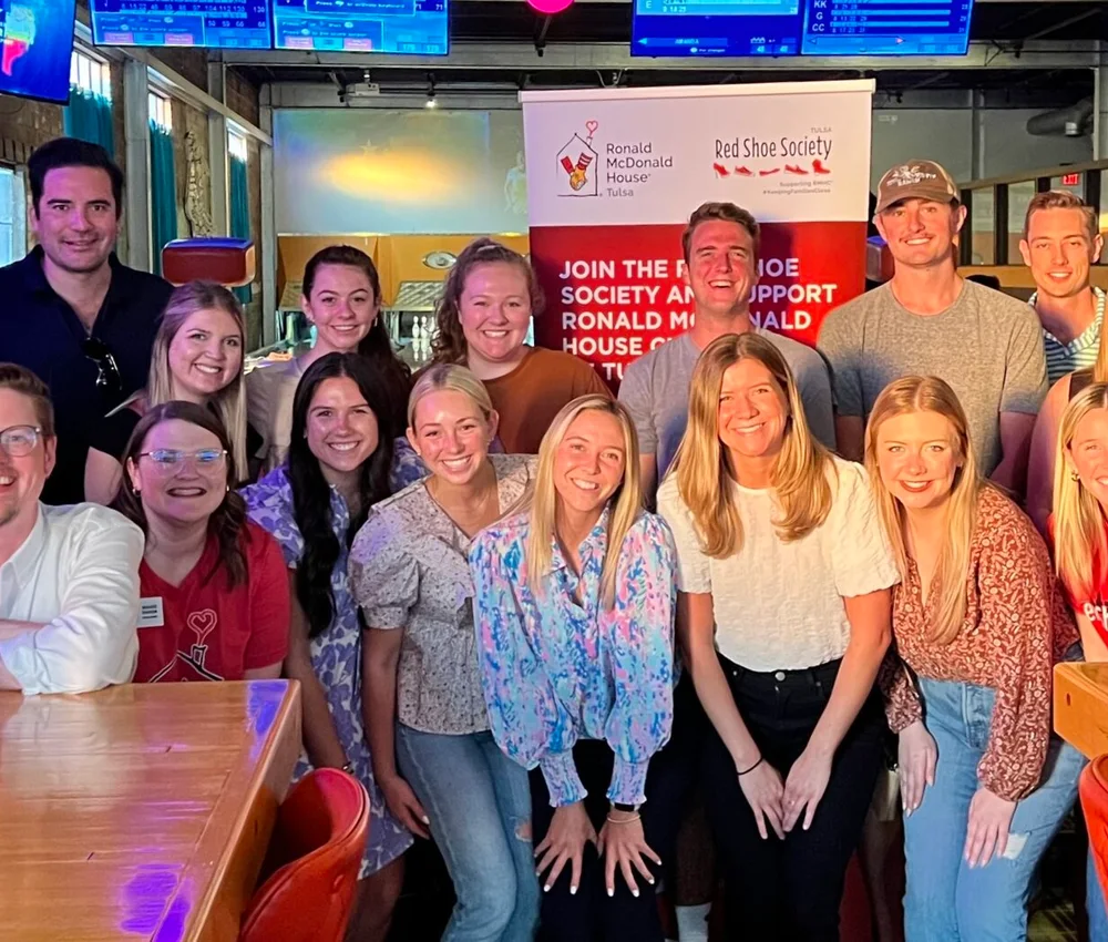 Red Shoe Society members gather at a Tulsa community event supporting Ronald McDonald House Tulsa.